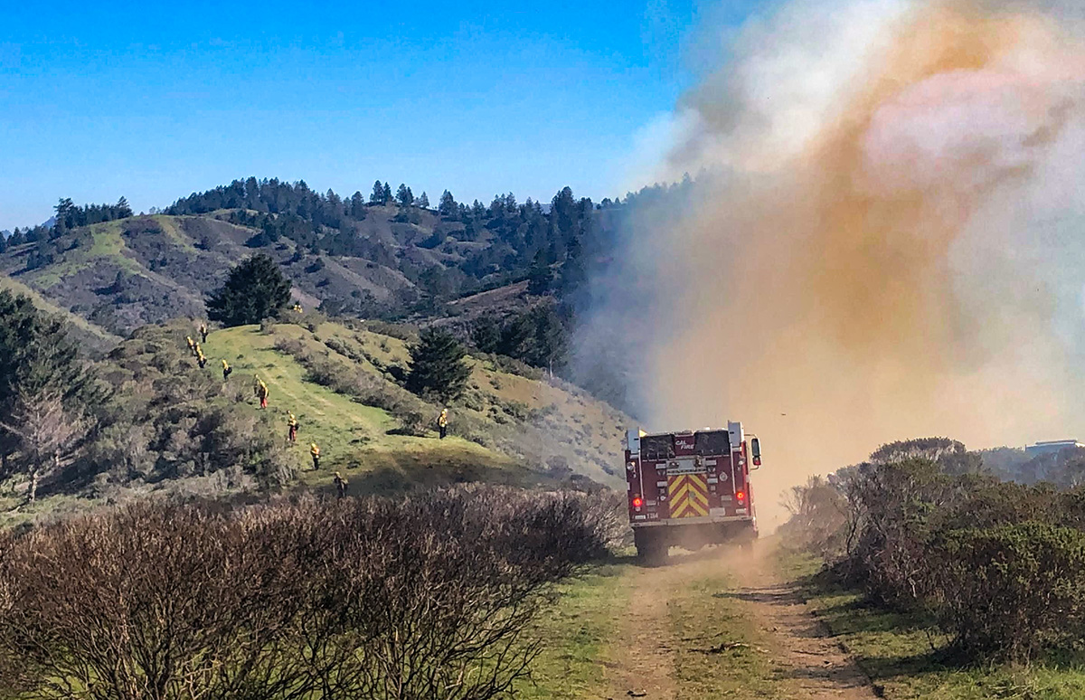 Cal Fire engine moves through the smoke ready to supply water if needed. Photo credit: Wendy Millet