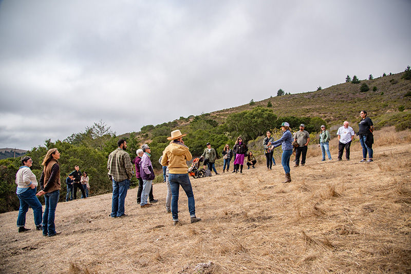 During a field walk, ranchers shared information about how regenerative practices can improve soil health, conserve water, promote animal welfare, strengthen community resiliency, and produce nutrient dense foods. 